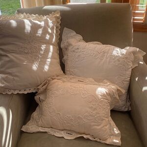 3 Vintage pillows, . 2 square snd 1 rectangular. Not hand made .